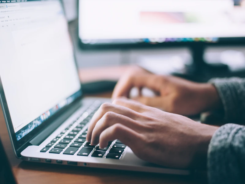 Professional focused on career growth with laptop